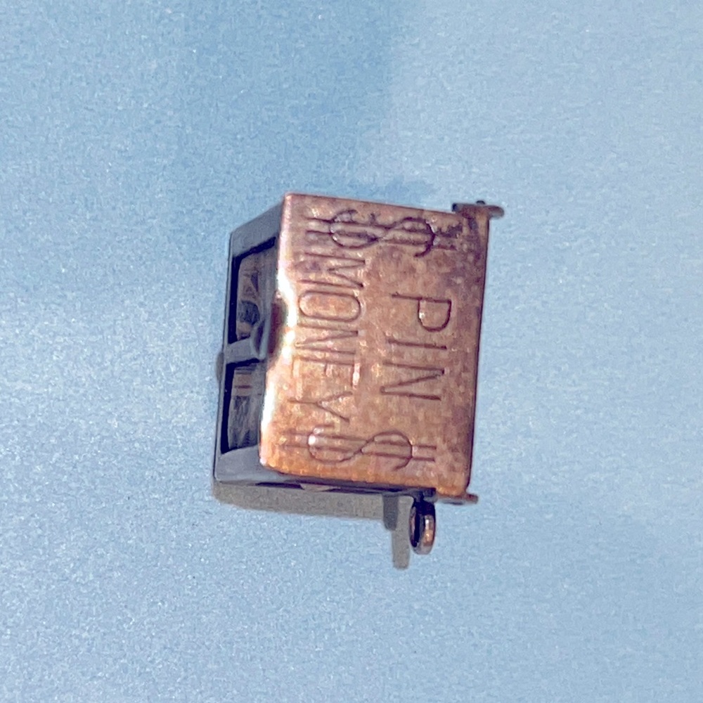 CHARM! Never have I ever seen one of these!